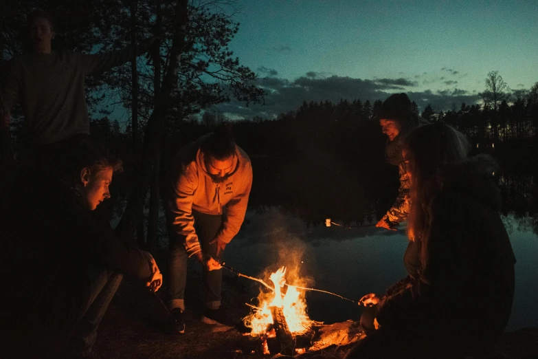 a group of people gathered around a campfire, pexels contest winner, romanticism, lakeside, thumbnail, lachlan bailey, al fresco