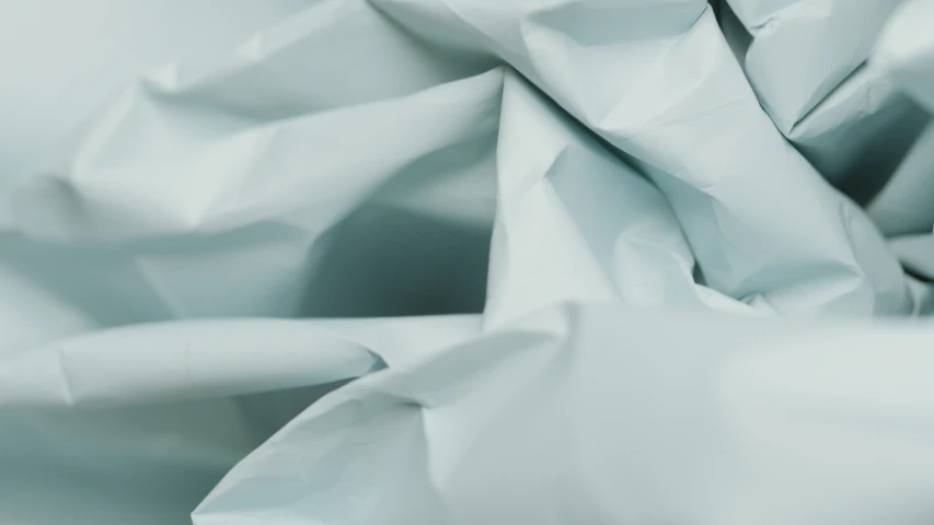a close up of a sheet of white paper, an abstract sculpture, unsplash, light blue skin, wrapped, ldpe, grey