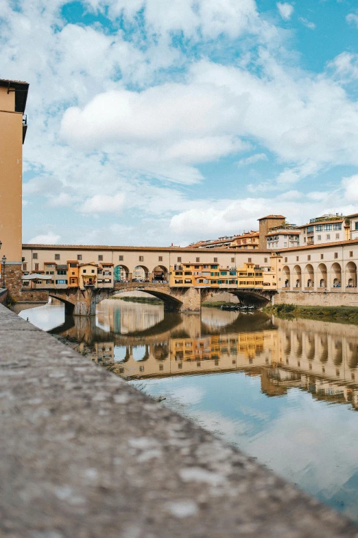 a bridge over a body of water with buildings in the background, renaissance, italian renaissance architecture, 2022 photograph, florence, square