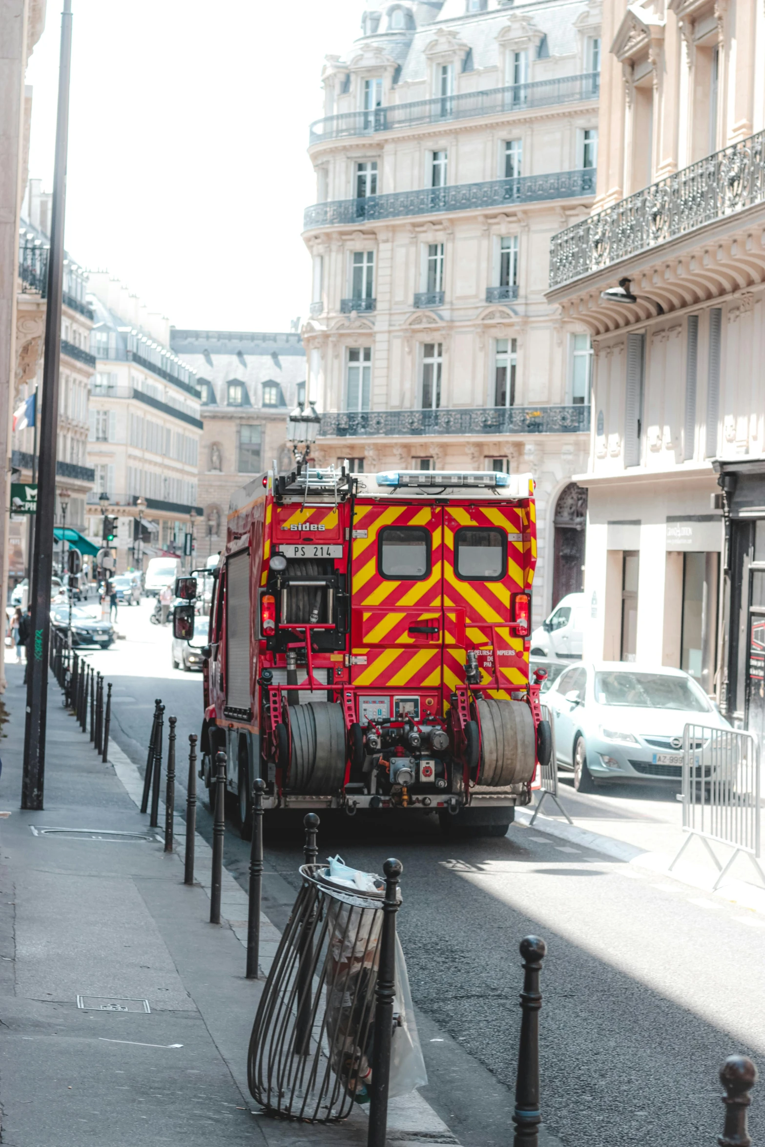 a fire truck parked on the side of a street, by Nina Hamnett, pexels contest winner, renaissance, paris city, summer day, square, high quality photo