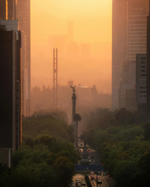 a city street filled with lots of traffic next to tall buildings, by Alejandro Obregón, pexels contest winner, tonalism, mexican, monument, gay, morning haze