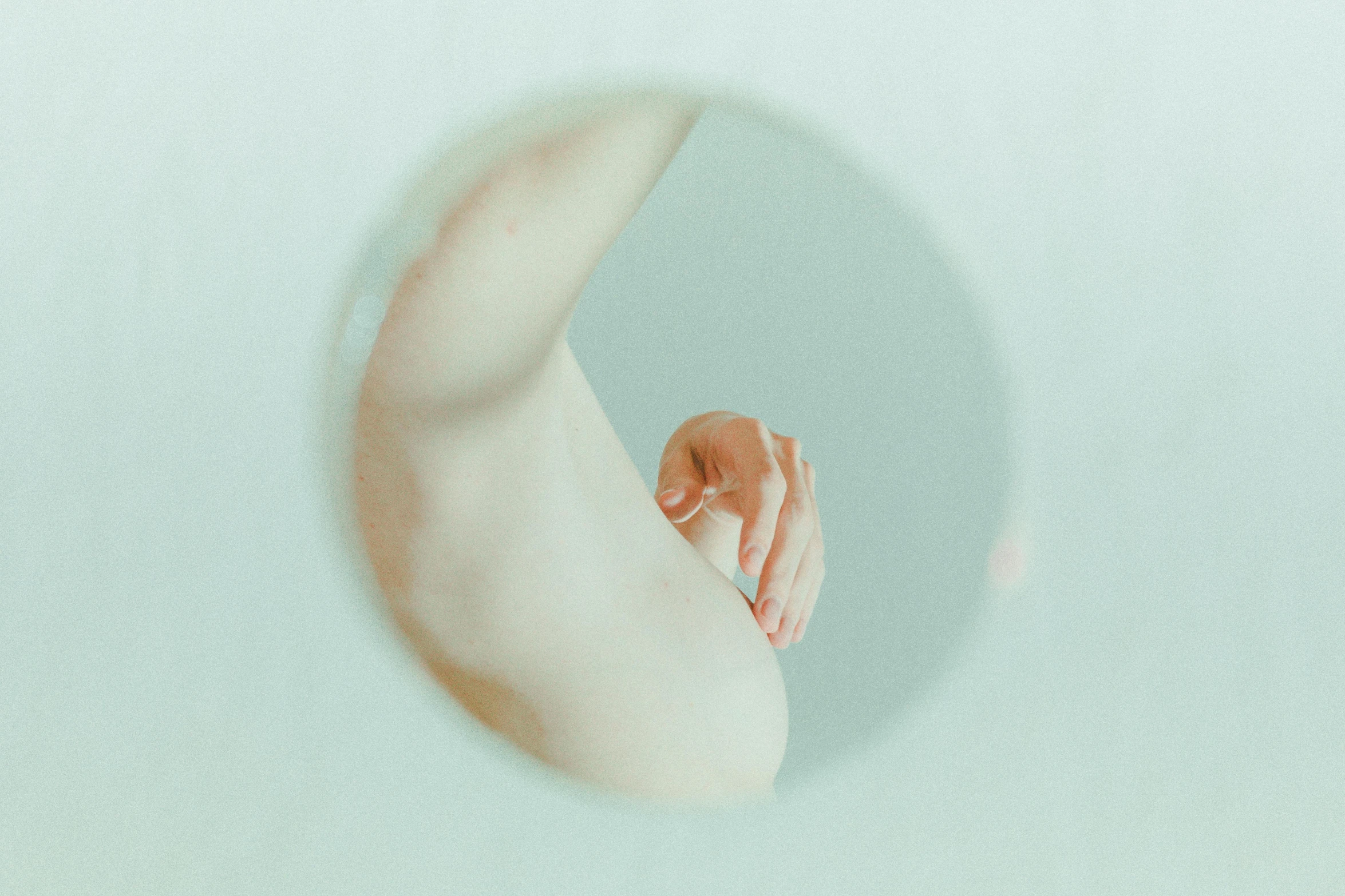 a person taking a picture of themselves in a mirror, an album cover, inspired by Ren Hang, unsplash, conceptual art, pregnant belly, women hand, cysts, soft organic abstraction