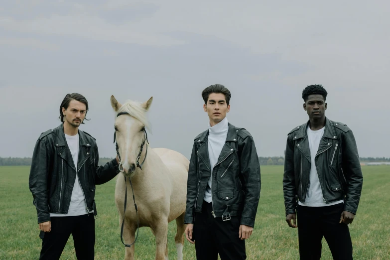 a group of men standing next to a white horse, an album cover, pexels contest winner, wearing a leather jacket, charli bowater and artgeem, photoshoot for skincare brand, performing a music video