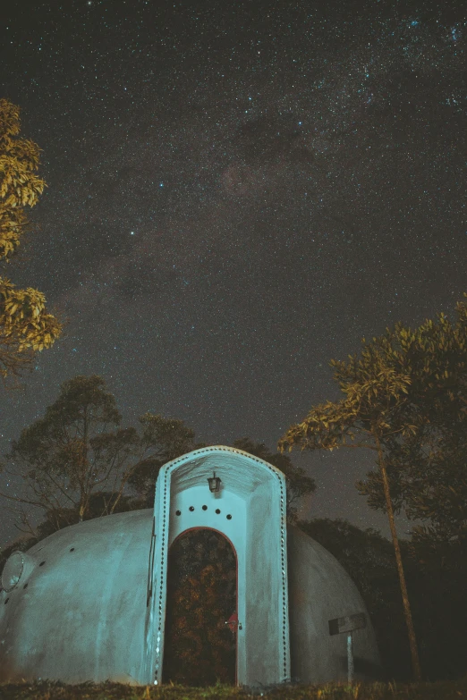 a small building in the middle of a forest at night, a picture, unsplash contest winner, visual art, dome, te pae, profile image, space ship cemetery outer space