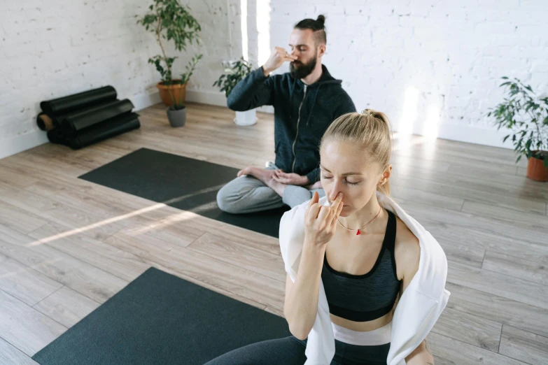 a man and a woman doing yoga together, pexels contest winner, coughing, low quality photo, acupuncture treatment, smoking with squat down pose
