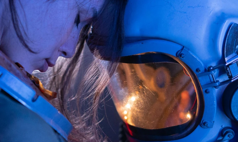 a close up of a person wearing a helmet, looking into a mirror, girl in space, welding helmet head, gemma chen