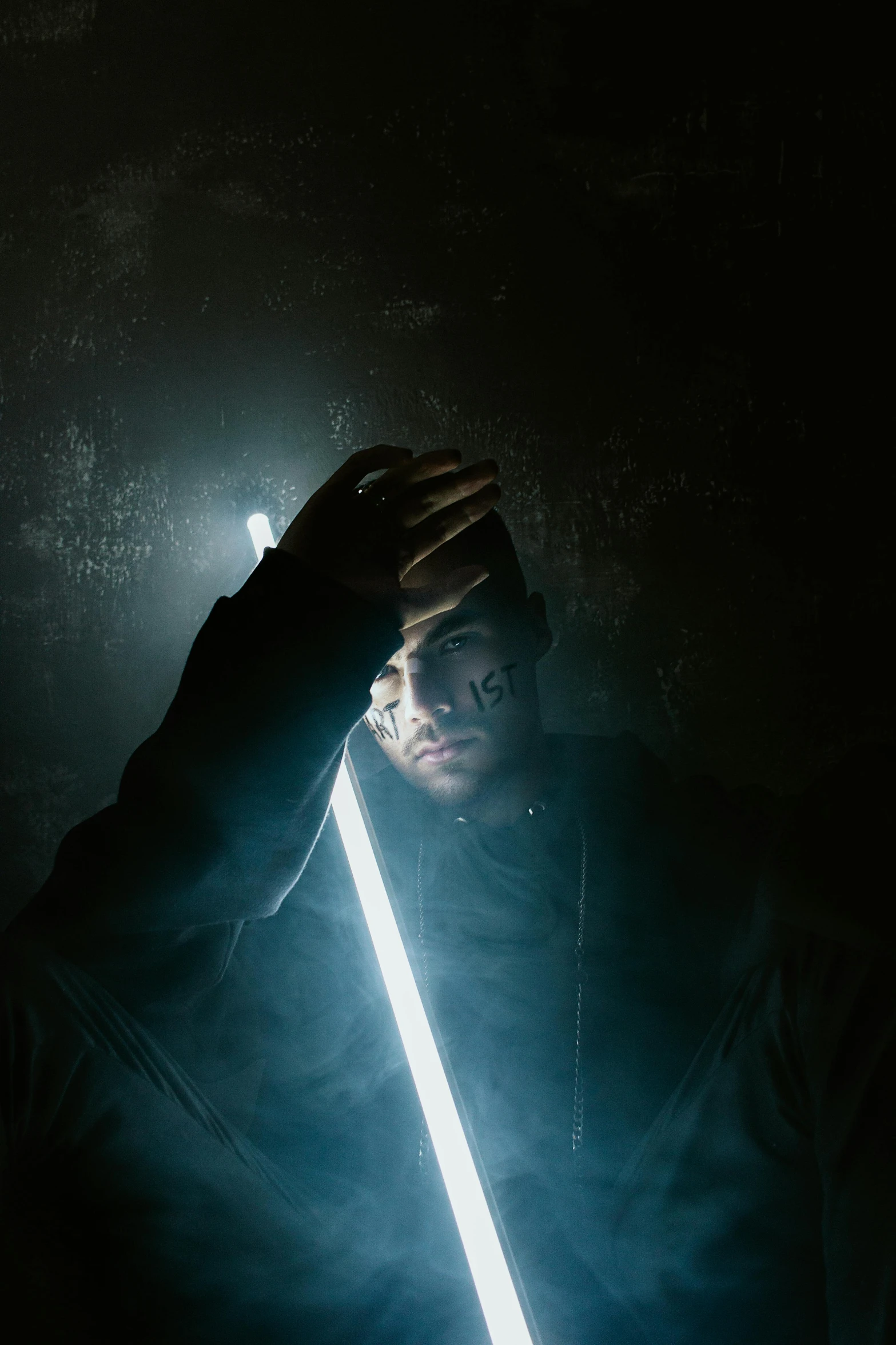 a man holding a light saber in the dark, an album cover, pexels contest winner, light and space, sick, highkey lighting, bad bunny, stable diffusion self portrait