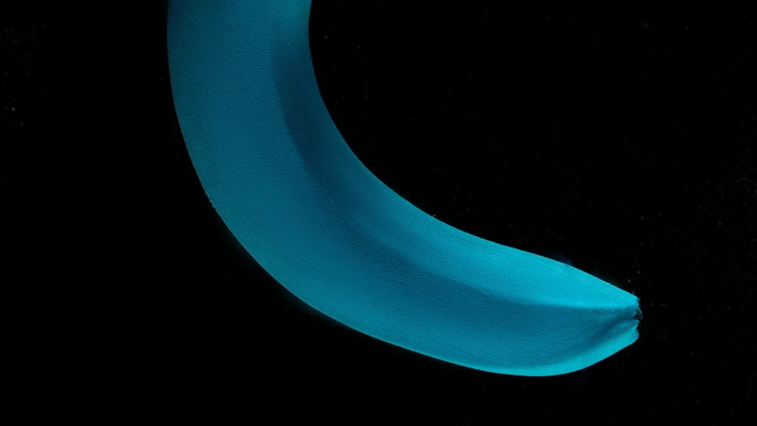 a close up of a blue banana on a black background, by Doug Ohlson, turquoise, made of glowing wax and ceramic, moonbow, detailed product image