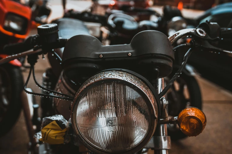 a close up of a motorcycle in a parking lot, pexels contest winner, round headlights, avatar image, thumbnail, multiple stories