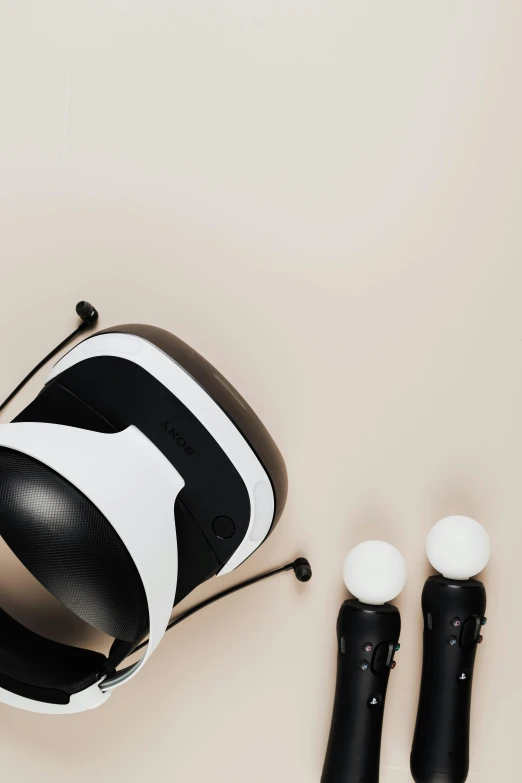 a pair of virtual glasses sitting on top of a table, inspired by Jean Tabaud, trending on pexels, cups and balls, studio lit, controllers, white and black color palette