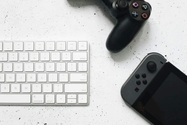 a close up of a keyboard and a game controller, a picture, by Carey Morris, unsplash, minimalism, style game square enix life, clean white background, taken with sony alpha 9, various items