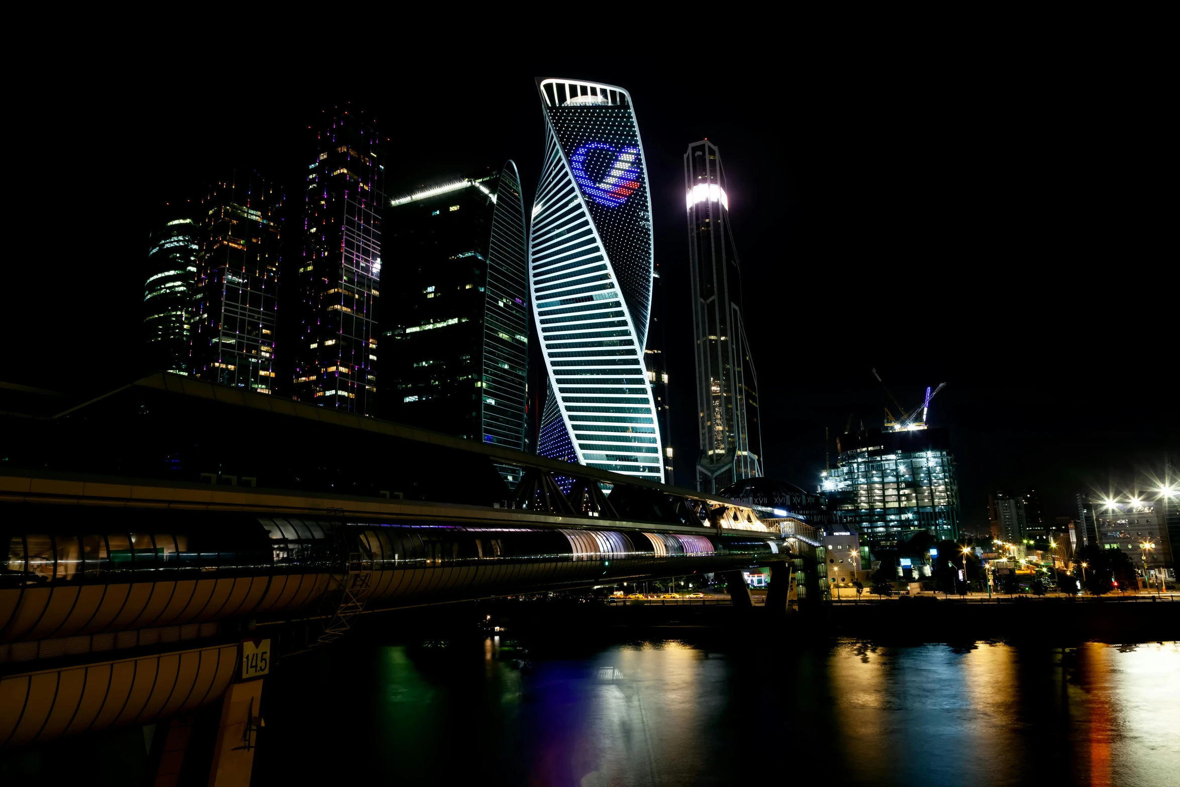 a train traveling through a city next to tall buildings, by Fyodor Rokotov, 1 glowing bridge crossing river, in moscow centre, curvy build, ap