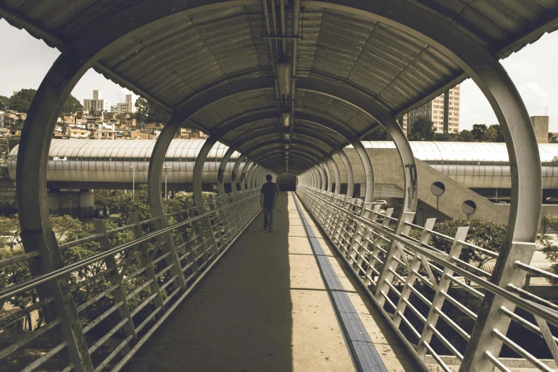 a walkway with a person walking on it, futuristic sao paulo, instagram picture, 2000s photo, fan favorite