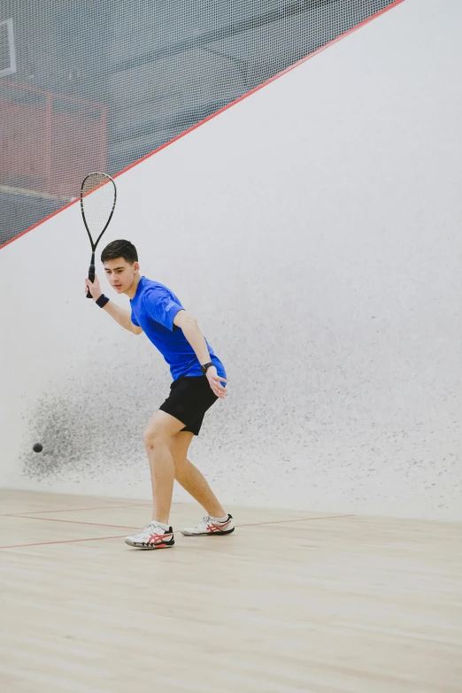 a man holding a tennis racquet on a court, by david rubín, square, amr elshamy, performing, indoor