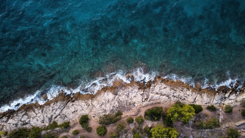 a view of the ocean from a bird's eye view, pexels contest winner, croatian coastline, rocky ground, cinematic footage, manly