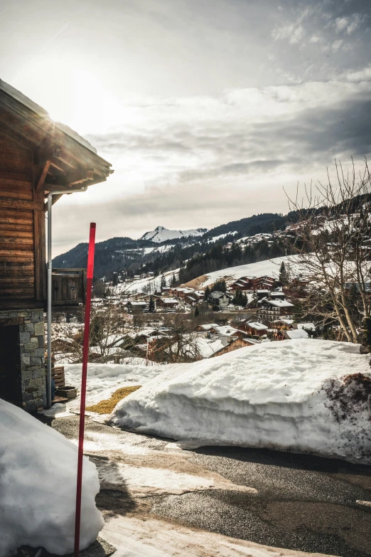 a man riding skis down the side of a snow covered slope, by Daniel Seghers, pexels contest winner, renaissance, luxurious wooden cottage, view from the street, today\'s featured photograph 4k, in front of a garage