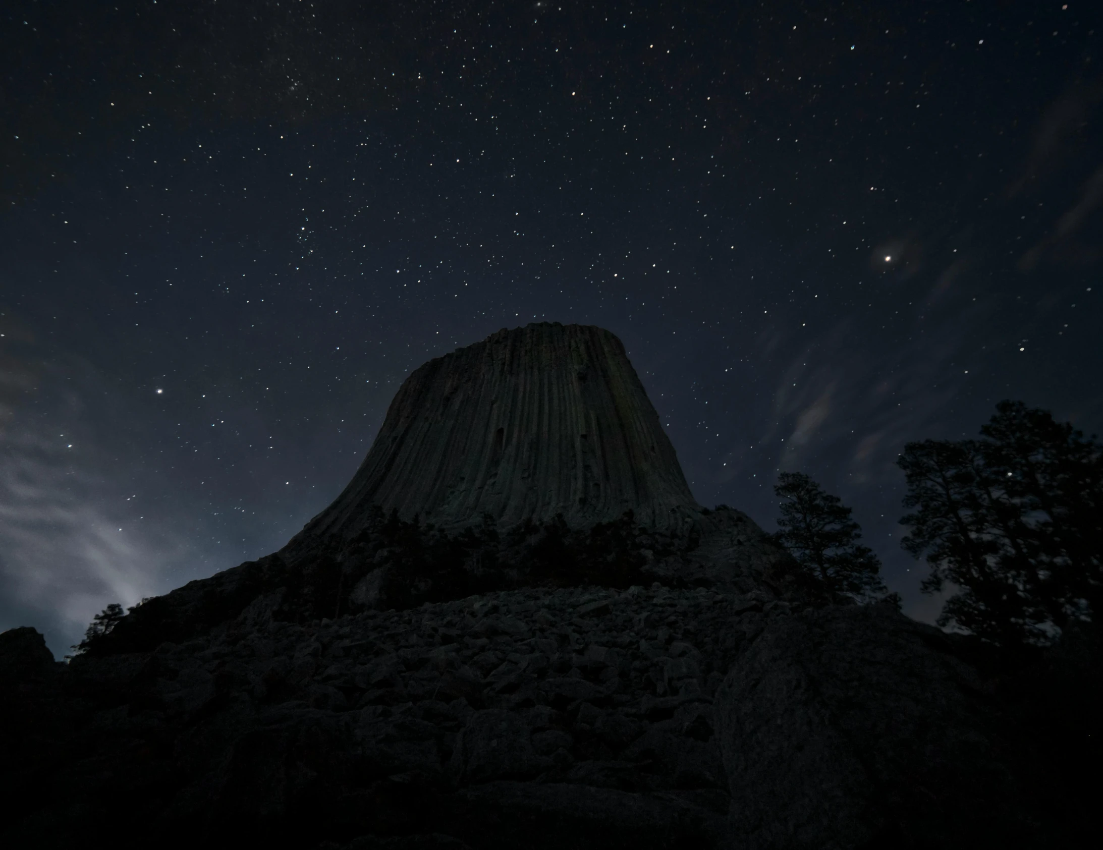 a mountain at night with stars in the sky, an album cover, unsplash contest winner, elden ring capitol, gray, wim wenders, monolith