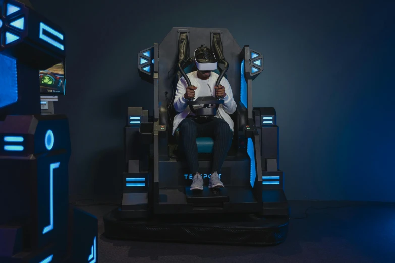 a person that is sitting in a chair, inspired by Beeple, interactive art, wearing a gaming headset, with people inside piloting it, thalassophobia, game ready