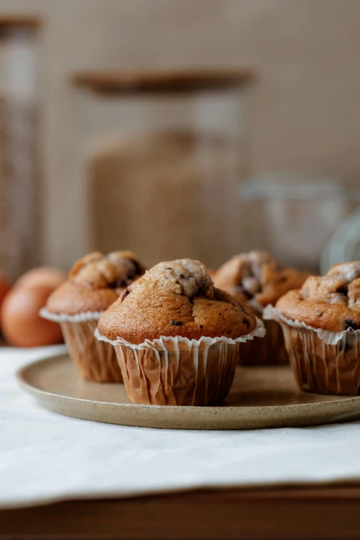 a plate that has some muffins on it, a still life, by Andries Stock, unsplash, panoramic, high quality image”, 0, kek