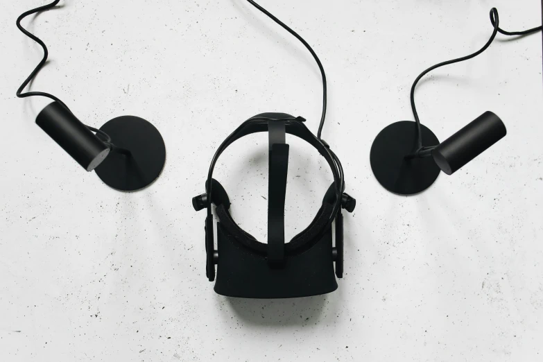 a pair of headphones sitting on top of a table, a 3D render, unsplash, fluxus, oculus rift, black color on white background, a middle-shot from front, panel of black