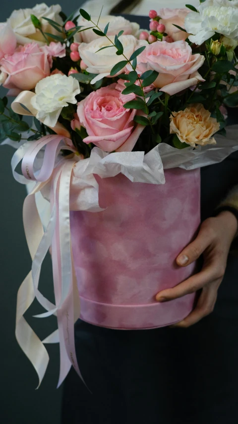 a woman holding a pink box filled with flowers, marbled, pink mist, made of silk paper, ekaterina