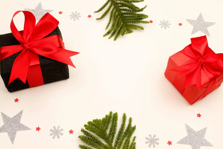 a couple of presents sitting on top of a table, red ribbon, profile image, background image, product shot