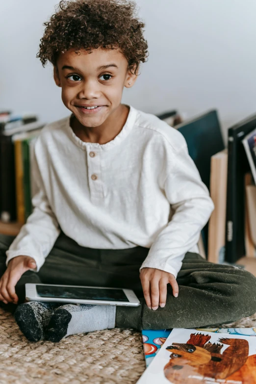 a little boy sitting on the floor with a laptop, pexels contest winner, happening, black boy shorts, wearing lab coat and a blouse, mobile learning app prototype, portrait of small