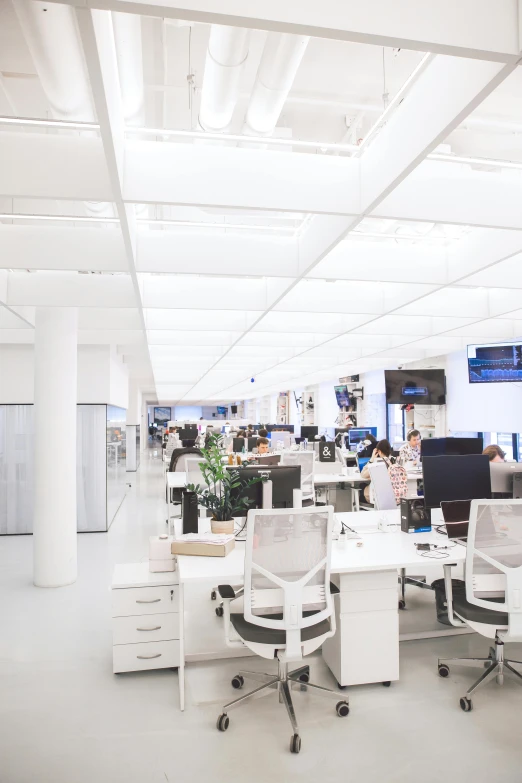 an office with a lot of desks and computers, trending on reddit, light and space, 2 5 6 x 2 5 6 pixels, fluorescent ceiling lights, ny, architectural digest