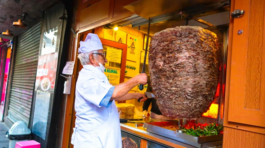 a man standing in front of a large piece of meat, greek nose, straining, mekka, featured