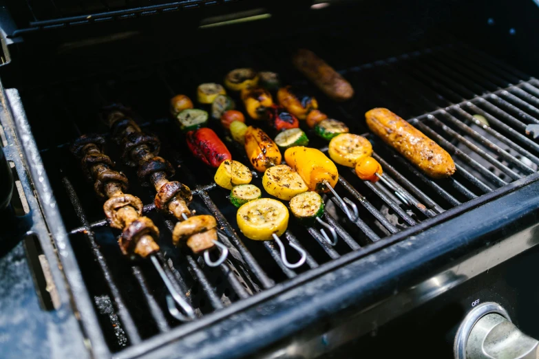 a grill filled with lots of different types of food, by Daniel Lieske, unsplash, “ iron bark, in a row, frying nails, instagram picture