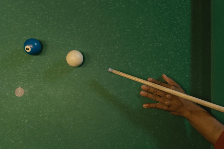 a person is playing a game of pool, by Elsa Bleda, photorealism, full frame image, rectangle, half blue, ignant