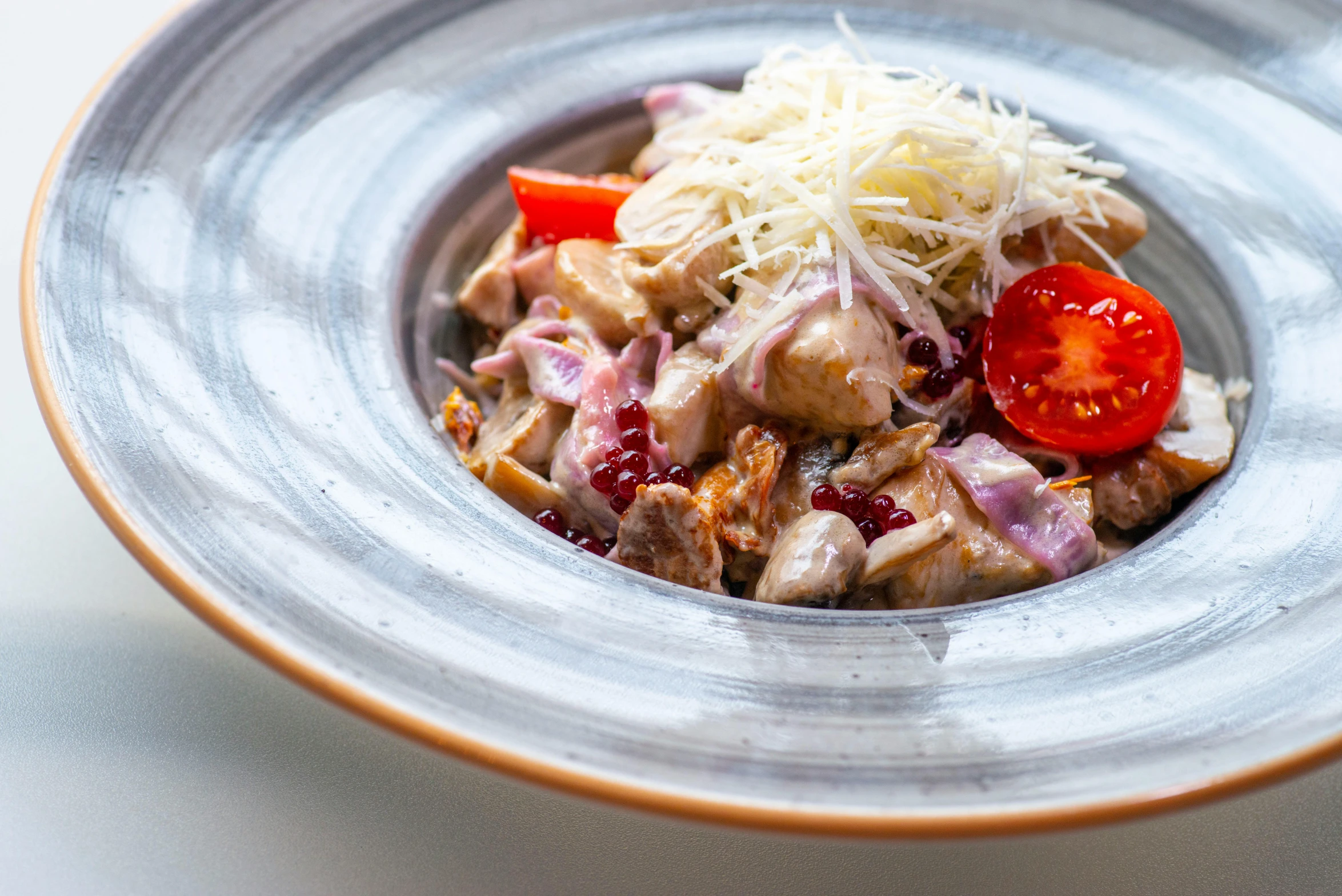 a close up of a plate of food on a table, by Emma Andijewska, fan favorite, silver white red details, salad, stew