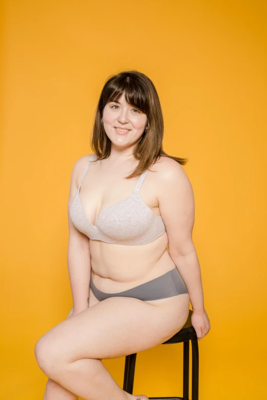 a woman in a bikini sitting on a stool, rebecca sugar, posing together in bra, attire: bikini, bbwchan