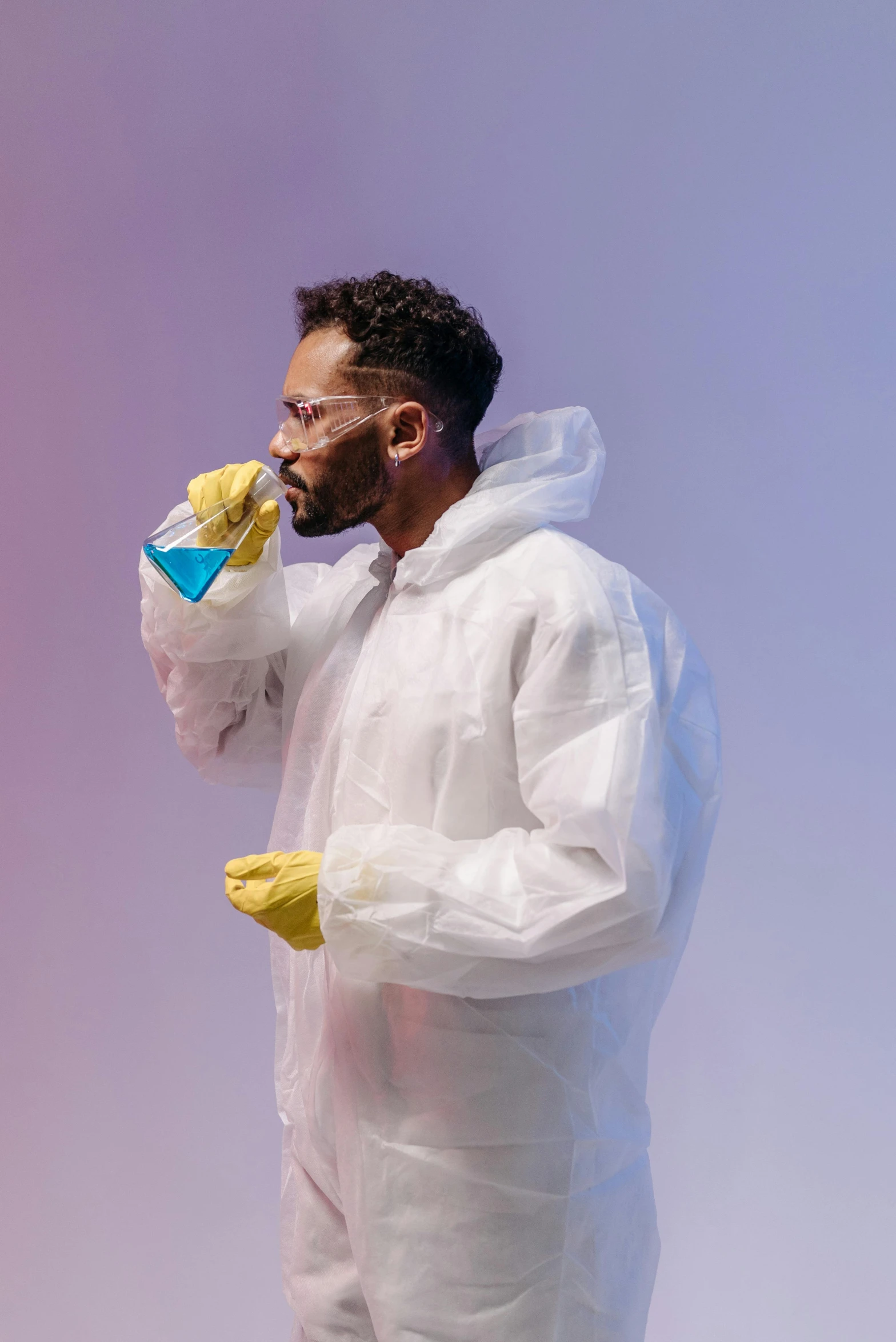 a man in a protective suit talking on a cell phone, pexels contest winner, process art, beakers of colored liquid, plain background, wearing white cloths, college