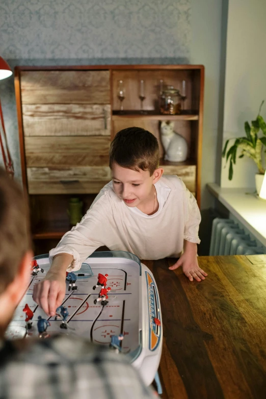 two boys playing a game of foo foo foo foo foo foo foo foo foo foo foo foo, by Adam Marczyński, featured on reddit, at home, humanoide robot, football, 15081959 21121991 01012000 4k