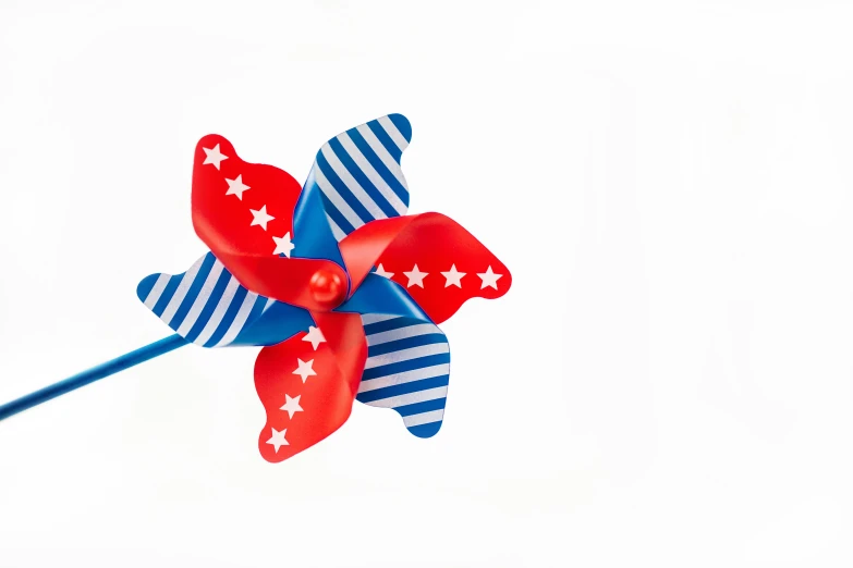 a red, white and blue pinwheel with stars, pixabay, plastic toy, product image, turbines, with a white background