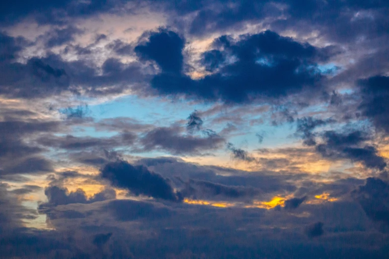 a large body of water under a cloudy sky, a picture, pexels contest winner, romanticism, blue sunset, layered stratocumulus clouds, blue - yellow sky, today\'s featured photograph 4k