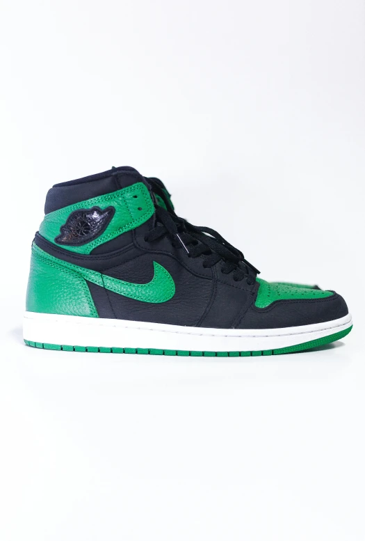 a pair of green and black sneakers on a white surface, an album cover, by Jesse Richards, unsplash, air jordan 1 high, right side profile, green lantern, high detail product photo