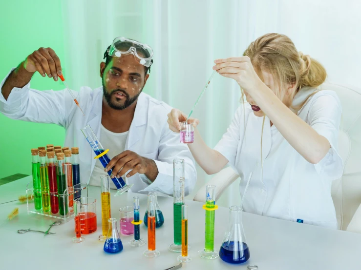 a man and a woman doing a science experiment, a colorized photo, pexels contest winner, mike tomlin as doctor who, mrbeast, acids, private school