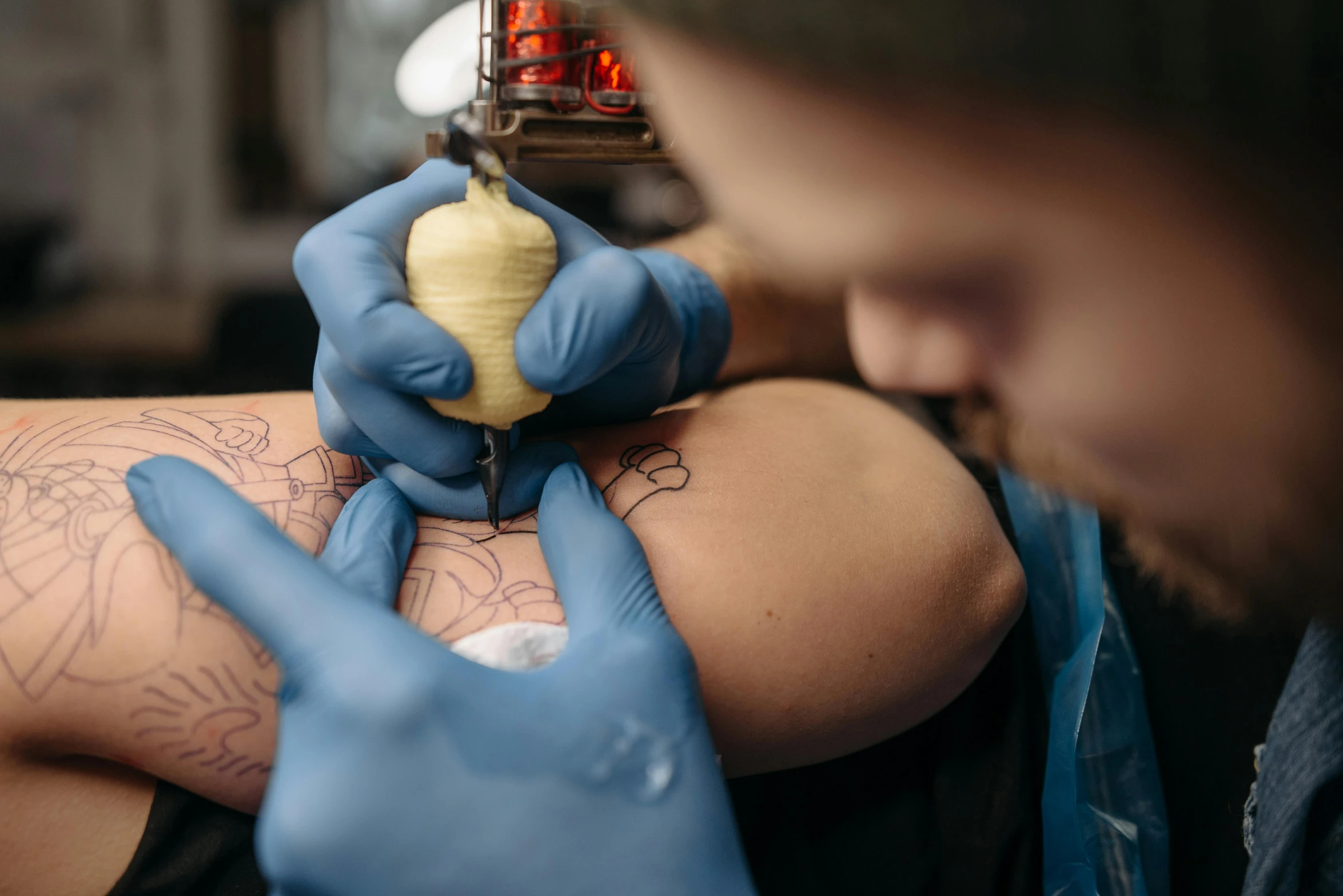 a man getting a tattoo on his arm, by Meredith Dillman, trending on pexels, blue ink, full colour, outline, te pae