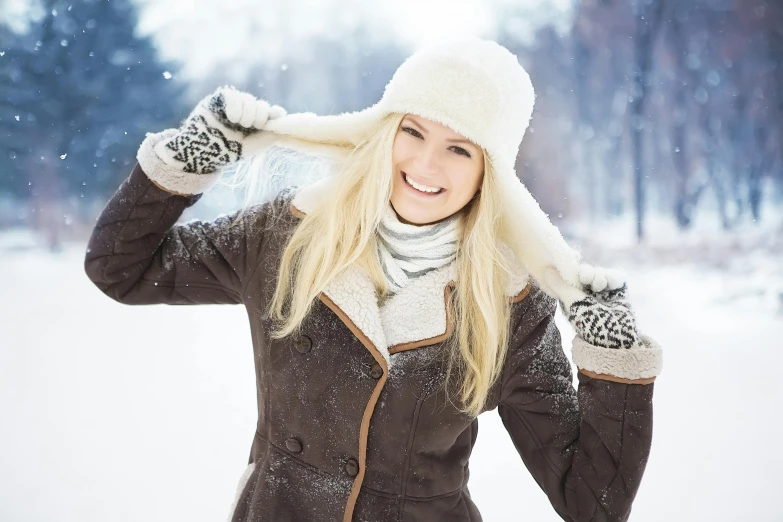 a woman is posing for a picture in the snow, blonde swedish woman, stockphoto, thumbnail, high quality image