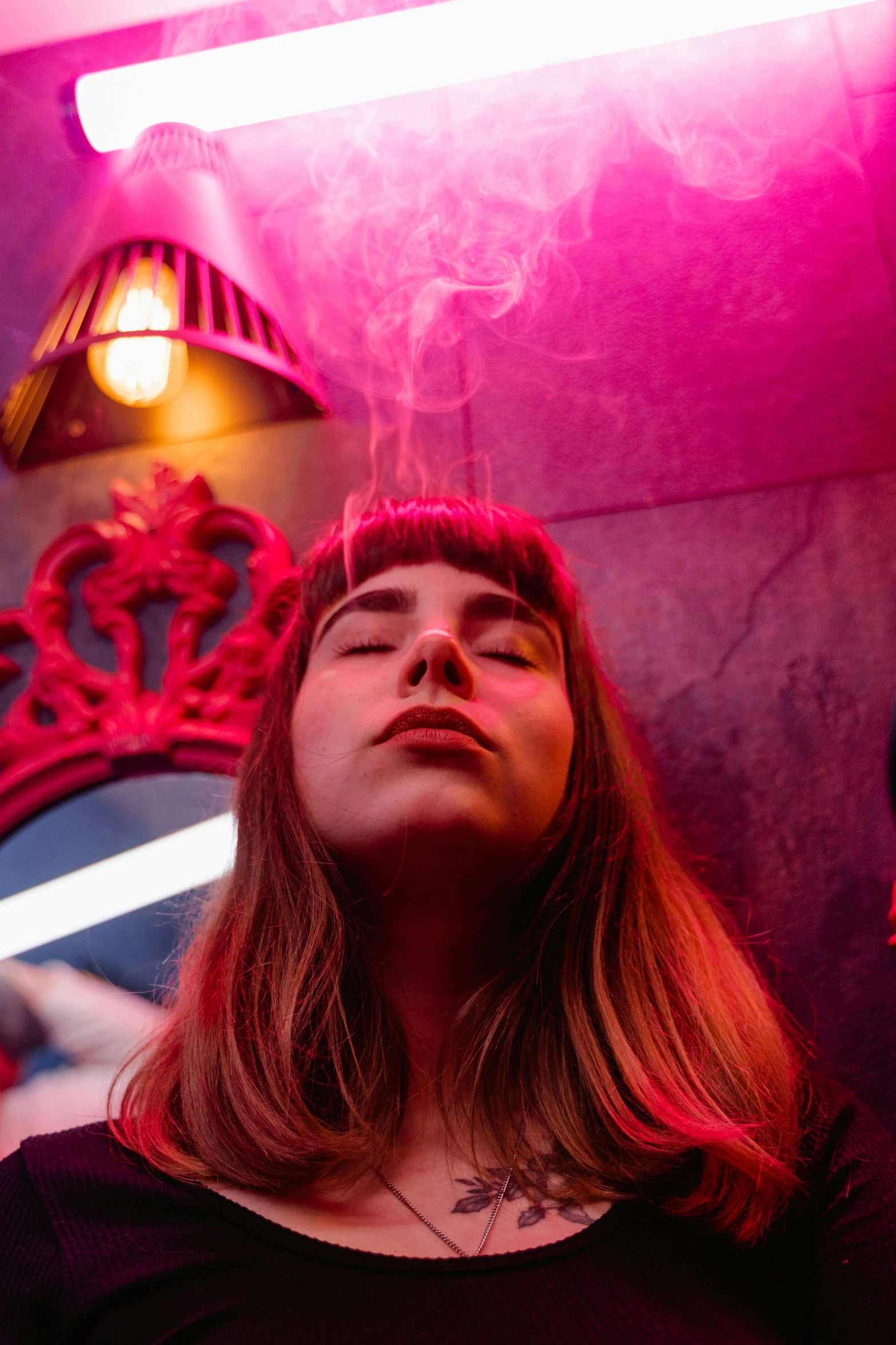 a woman that is standing in front of a mirror, inspired by Elsa Bleda, trending on pexels, lights and smoke, in a nightclub, personification of marijuana, magenta