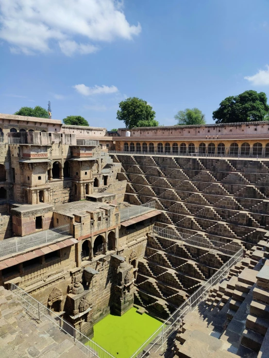 a large structure in the middle of a body of water, ancient india, inside a castle courtyard, thumbnail, biopic