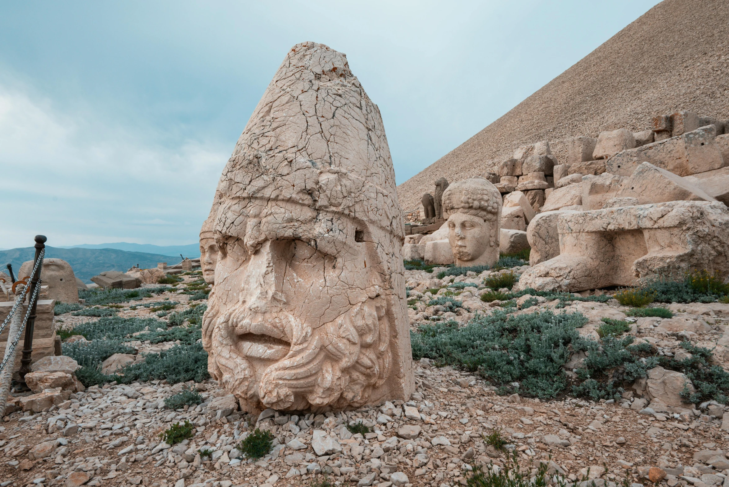 a stone statue in the middle of a field, by Arthur Sarkissian, pexels contest winner, les nabis, sepals forming helmet, located in hajibektash complex, beautiful faces, 2019 trending photo