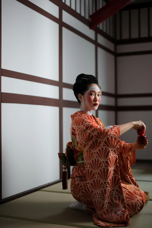 a woman in a kimono sitting on the floor, a portrait, inspired by Ogata Kōrin, unsplash, she is dancing, seated on a throne, promotional photo, ( ( theatrical ) )