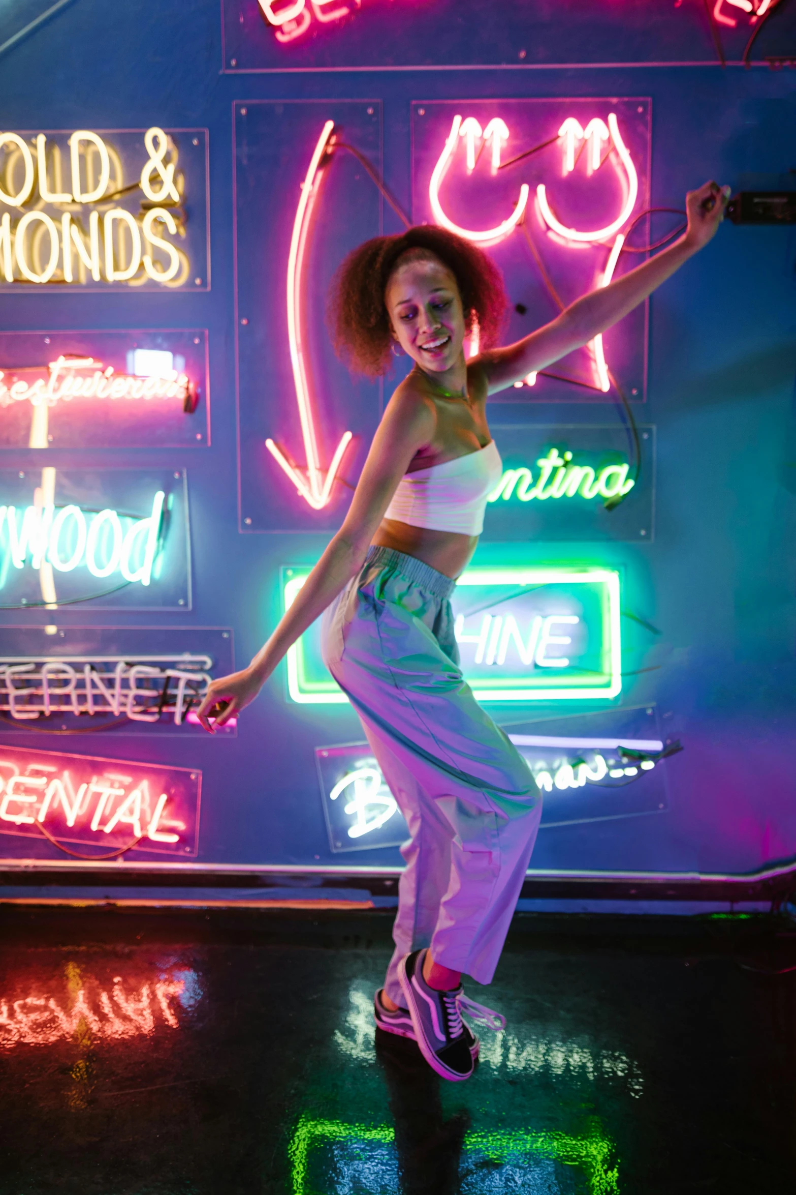 a woman dancing in front of neon signs, trending on pexels, nathalie emmanuel, doja cat, high lights, broad