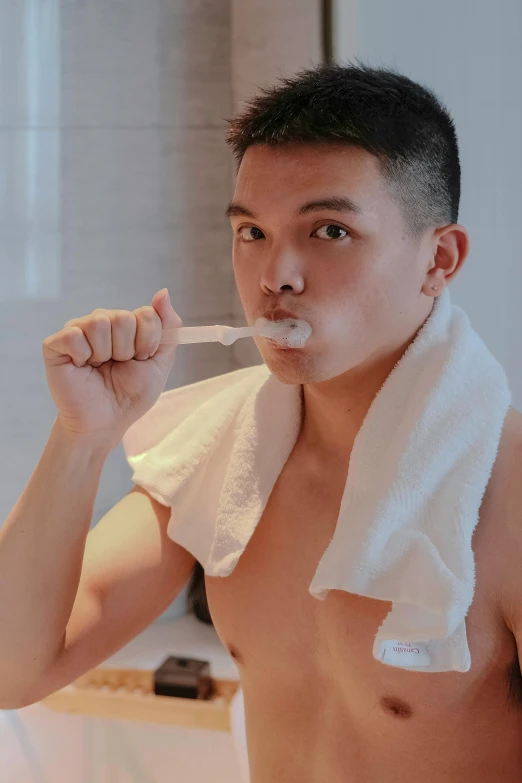 a man brushing his teeth in front of a mirror, a colorized photo, inspired by Ding Guanpeng, reddit, sweaty. steam in air, set on singaporean aesthetic, marshmallow, profile image