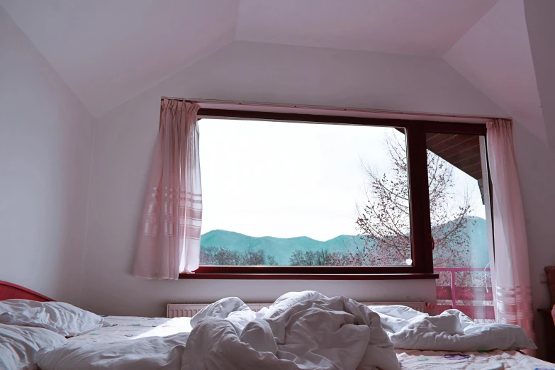 an unmade bed in a bedroom with a mountain view, an album cover, inspired by Elsa Bleda, magical realism, ((pink)), desktop wallpaper, 1990s bedroom, a 35mm photo