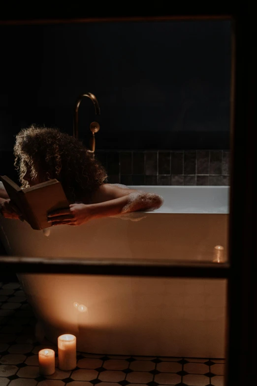 a teddy bear sitting in a bathtub next to a lit candle, a portrait, inspired by Elsa Bleda, pexels, dramatic reading book pose, lighting her with a rim light, dwell, gif