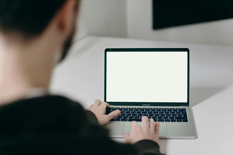 a woman using a laptop computer with a blank screen, by Carey Morris, pexels, future coder man looking on, clean and simple design, thumbnail, background image